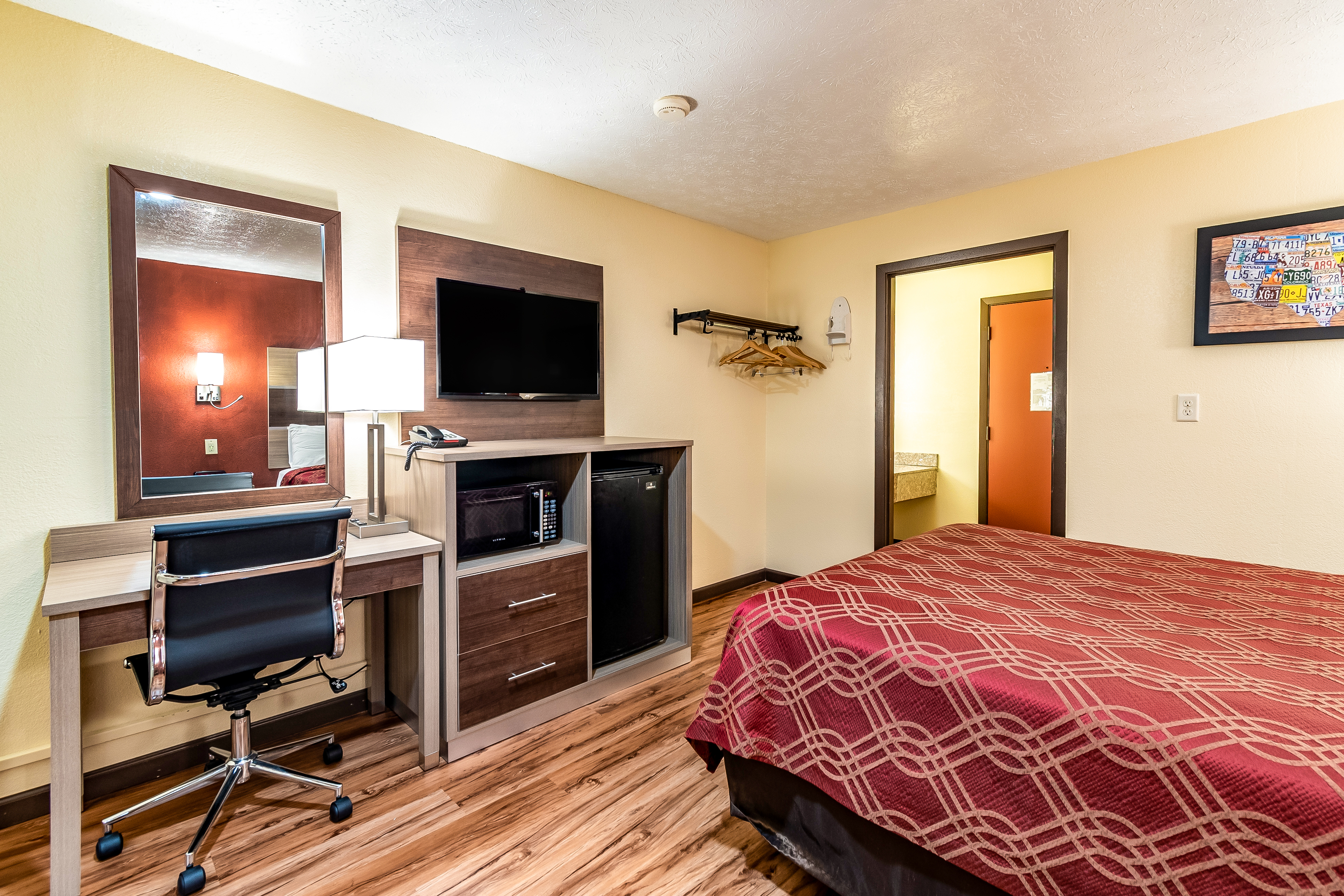 Queen bedroom desk and amenities